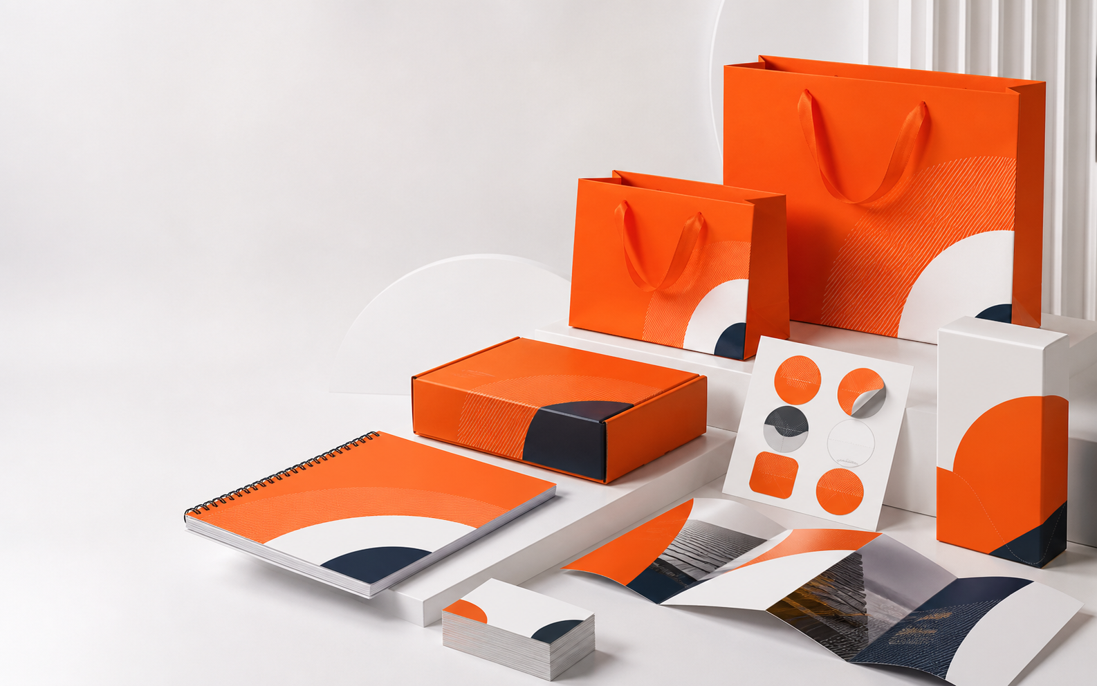 Bộ ấn phẩm in nhanh chuyên nghiệp màu cam gồm túi giấy, hộp, catalogue, name card và sticker